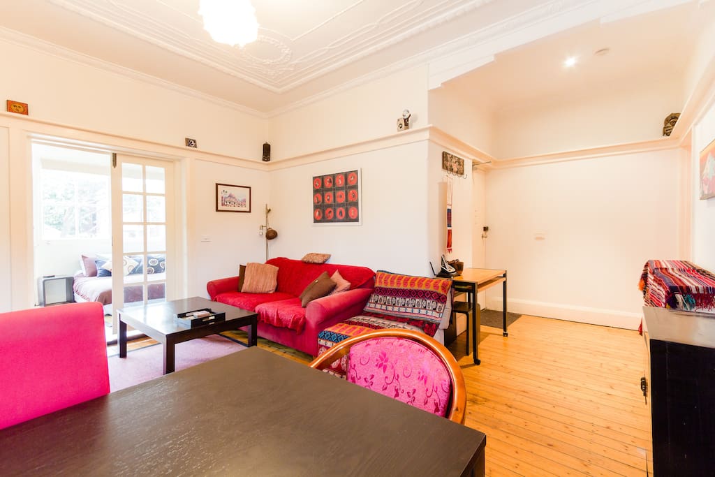 Lounge room, with large plasma tv, dvd player, dining table etc