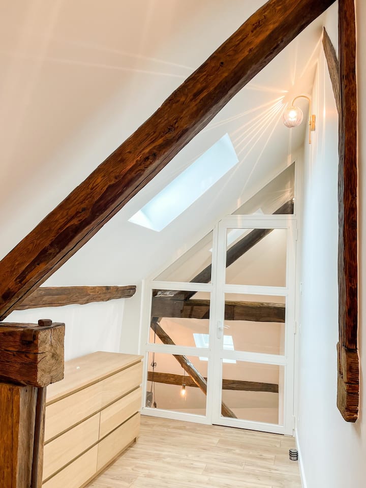 The upstairs bedroom, a charming space reminiscent of the spirit of a real Cabin.