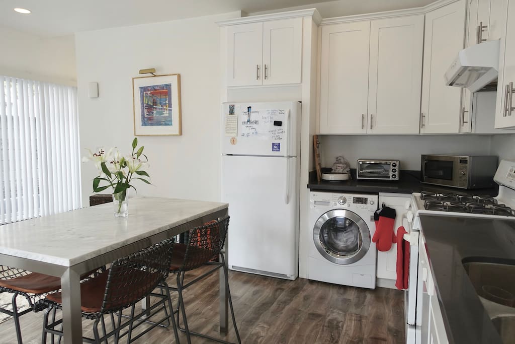 Dining table for 4. Washer-dryer combo.