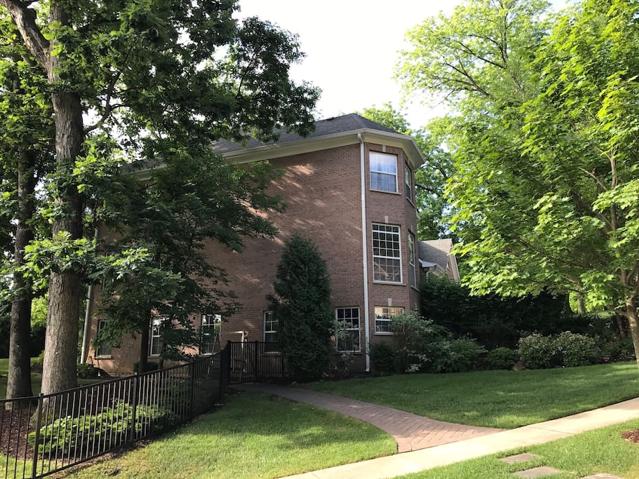 Northwest corner of house with walking path to walk out basement door