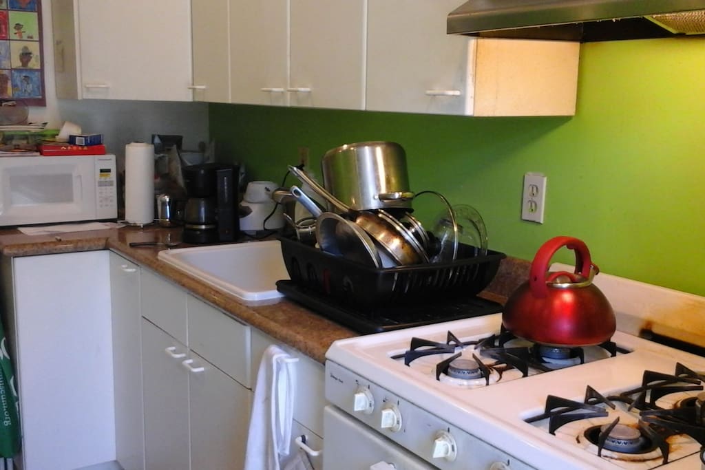 Comfortable kitchen with all the necessary dishes/pots/pans that you might need