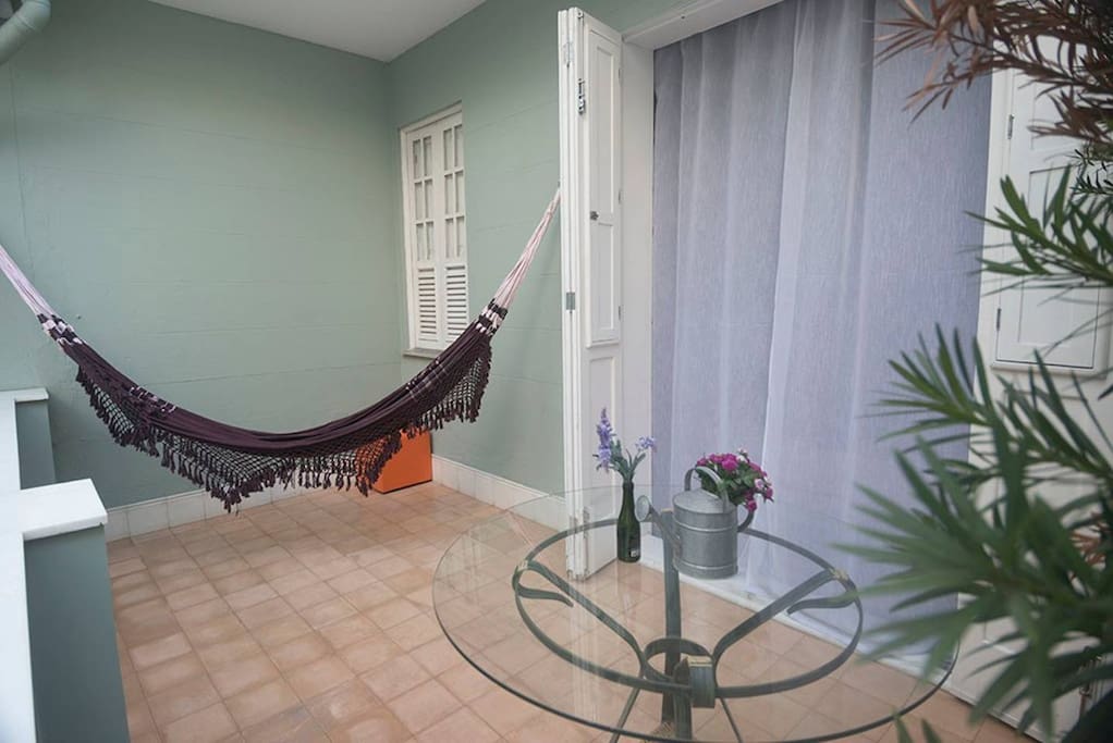 The private veranda with hammock and table