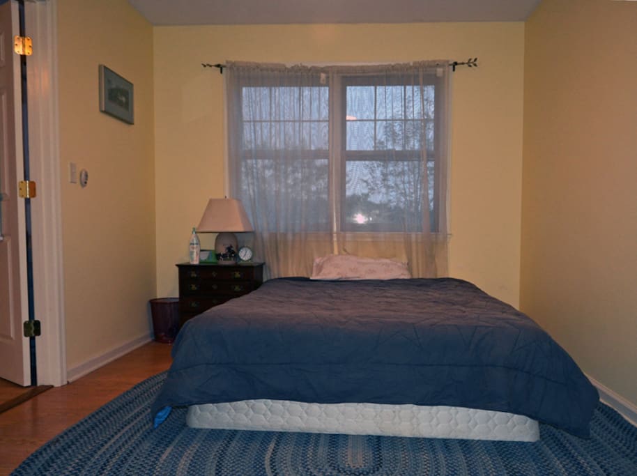 Queen-sized bed in the bedroom.