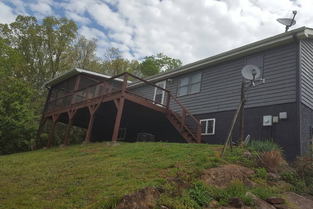 Enjoy the peace and tranquility on the back deck overlooking distant mountainous ranges. Open area with Gas bbq and a screened In dining area.