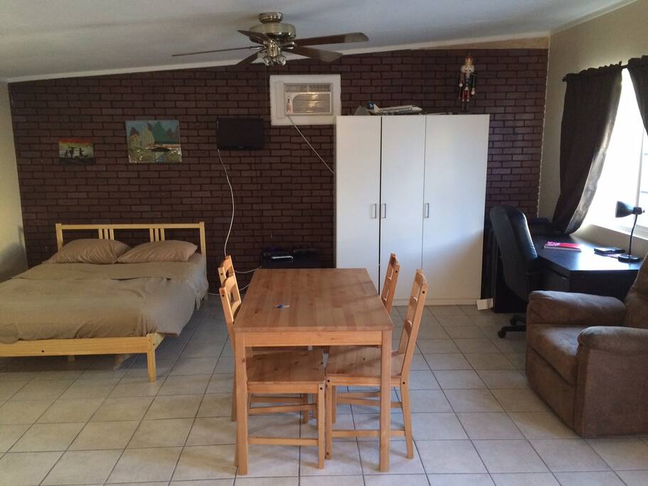 View from Entry... Full size bed, Table for 4, TV, Desk.