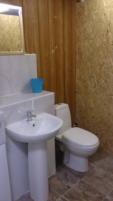 WC and sink in the wash hut. There is also a kitchen sink for washing up.