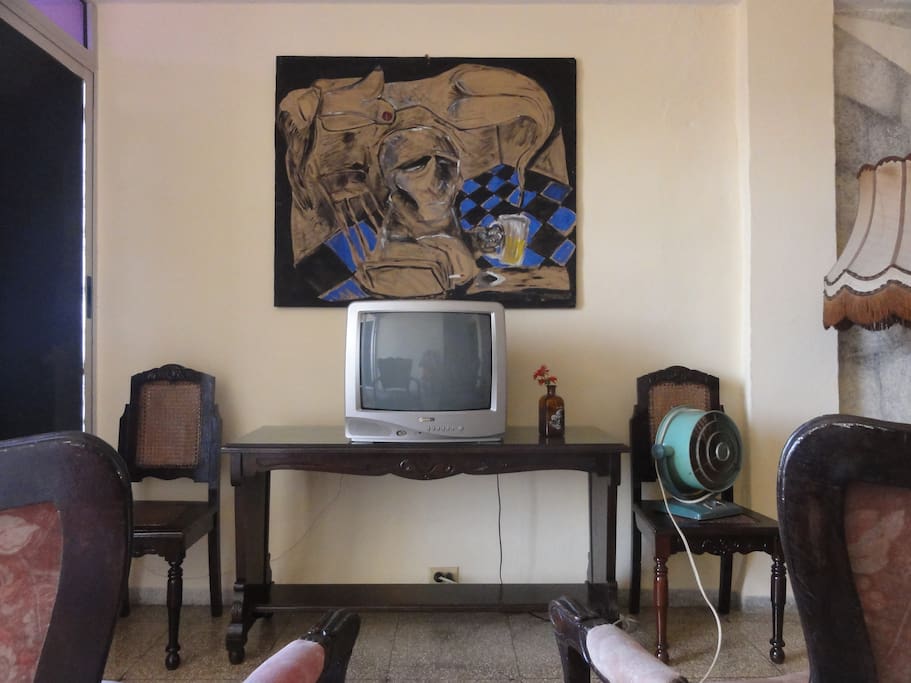 Sitting room. TV and old-fashion ventilator.