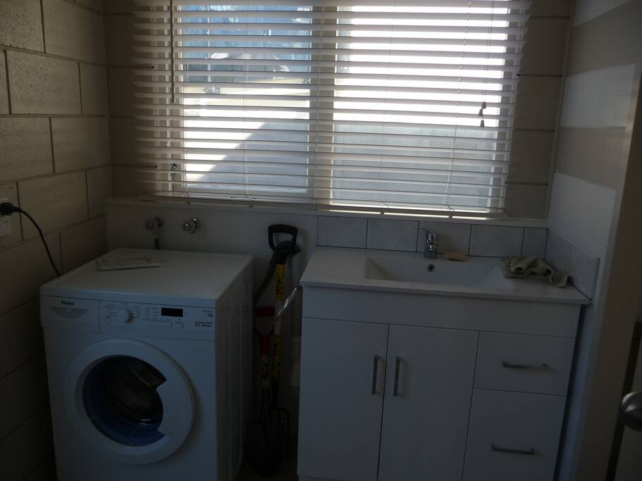 Laundry and bathroom area