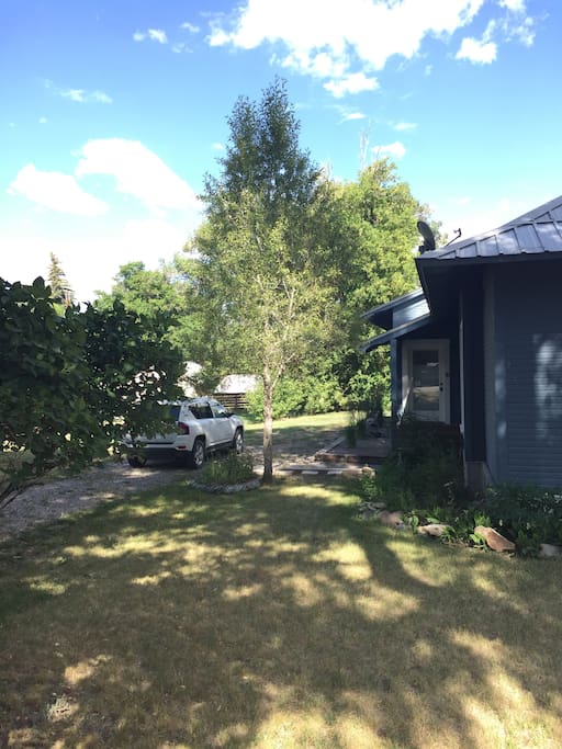 Plenty of parking for your car, SUV, trailer. Large extra yard to the side (left) for running, sprinkler, games (all fenced).
