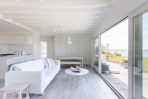 Savor Blazing Ocean Sunsets at a Soothing Beachfront Haven