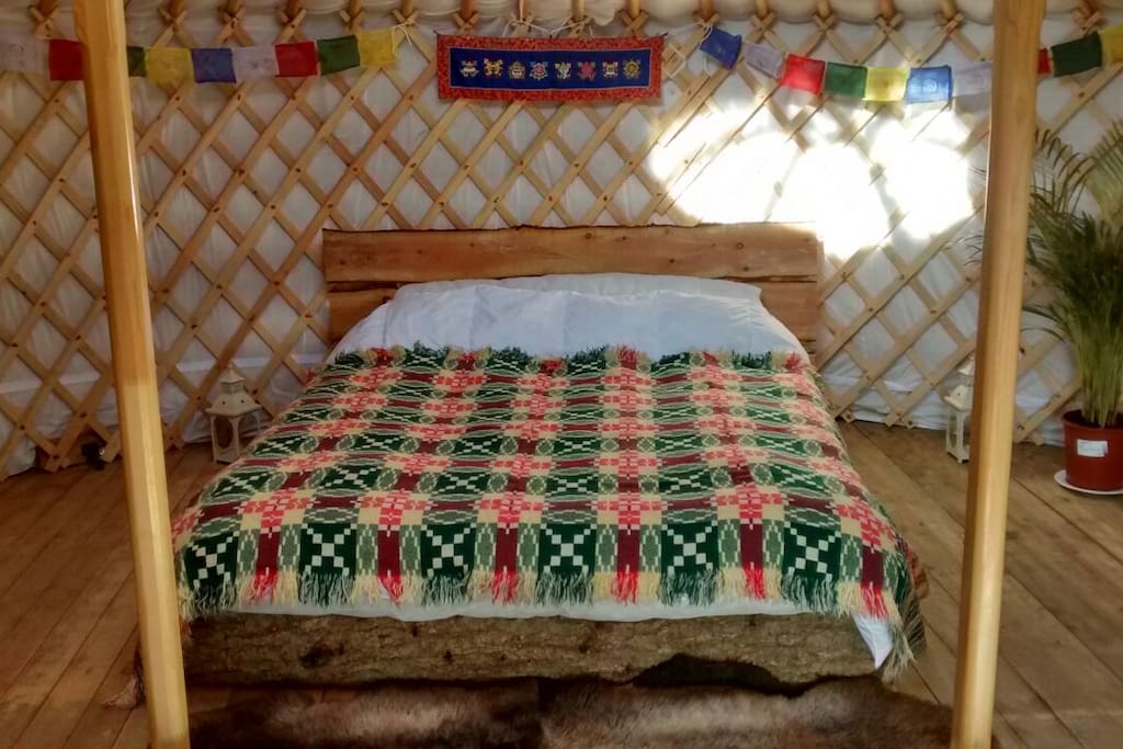Kingsize bed handmade from a whole tree