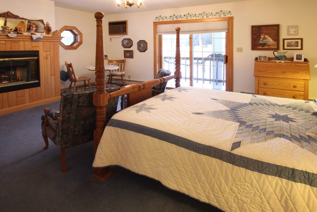 Queen bed, private bath, fireplace and patio door to the large wrap around deck