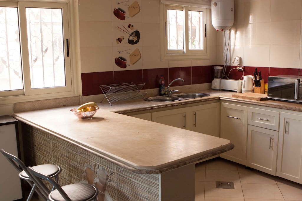 Fully equipped and stocked kitchen area.