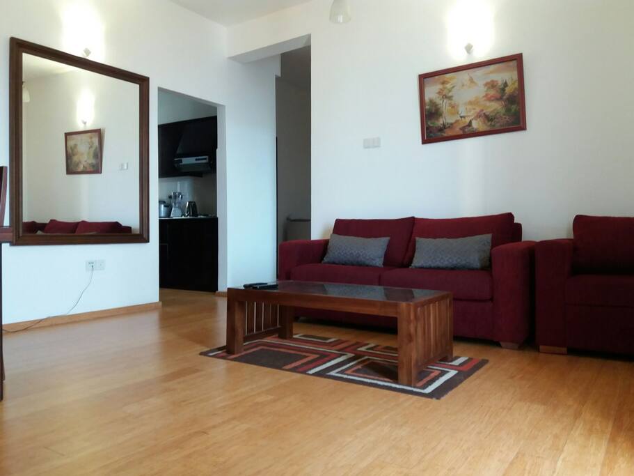 sitting area with a huge wall mirror
