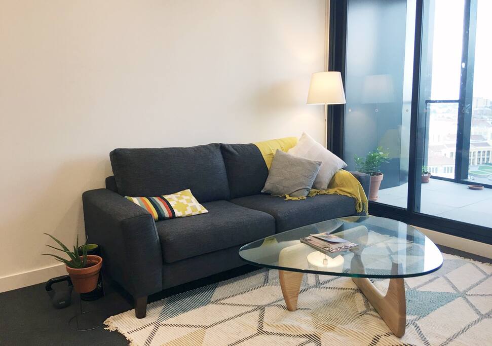 Homey living room with collection of travel information.