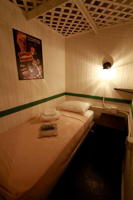 Cabin sleeps one. Has trellis ceiling and shared bathroom.