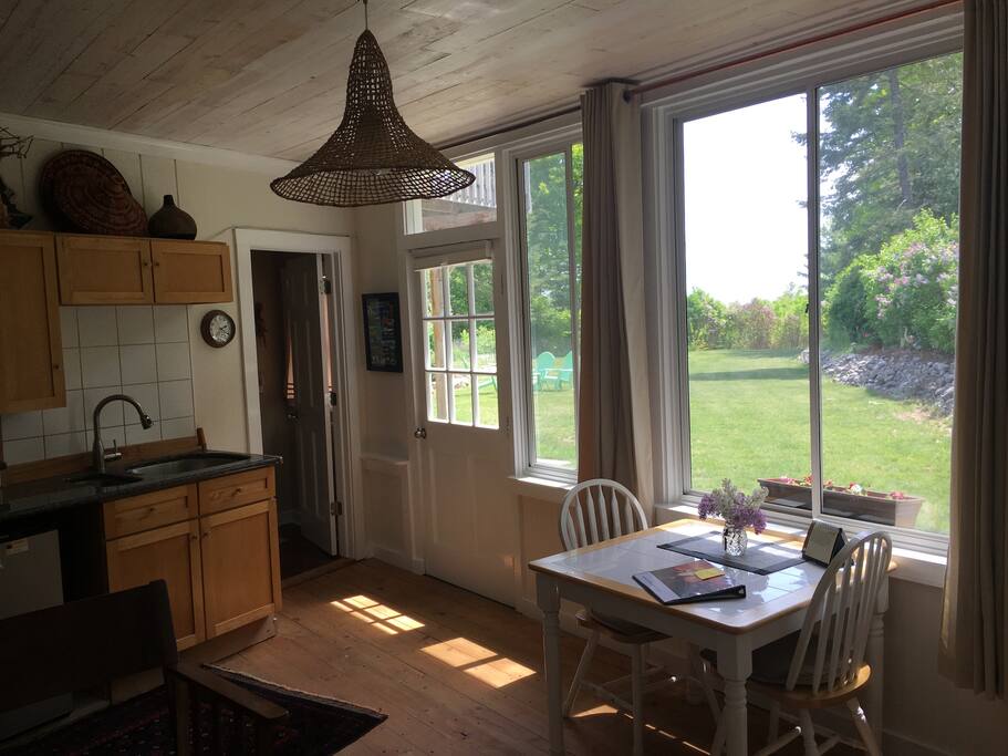 Entry door, door to bathroom, dining
