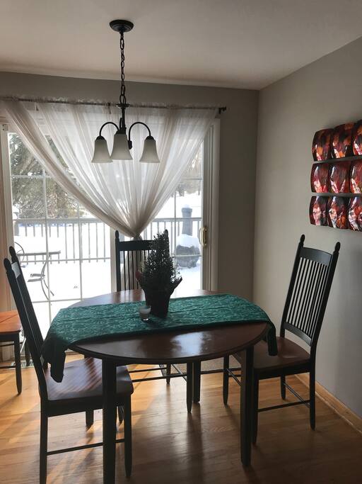 Dining Room (table extends to 6+ seats) with Doors out to deck.
