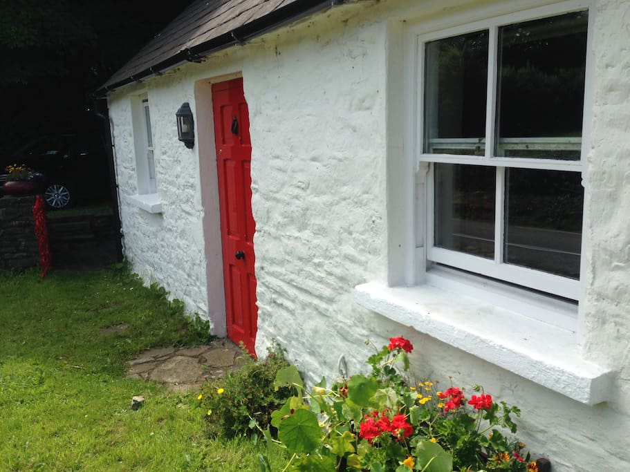 Front of cottage with part of garden