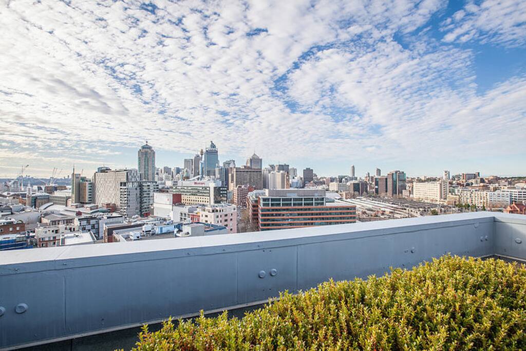 View of the city from the rooftop of apartment building - nice place for lunch!