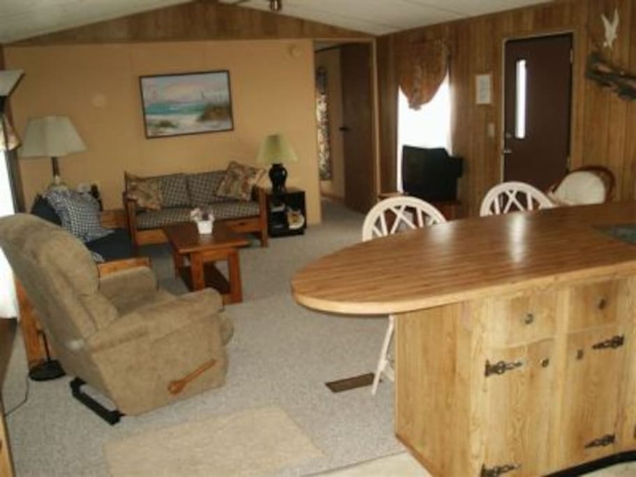 Another view of living room showing breakfast bar.
