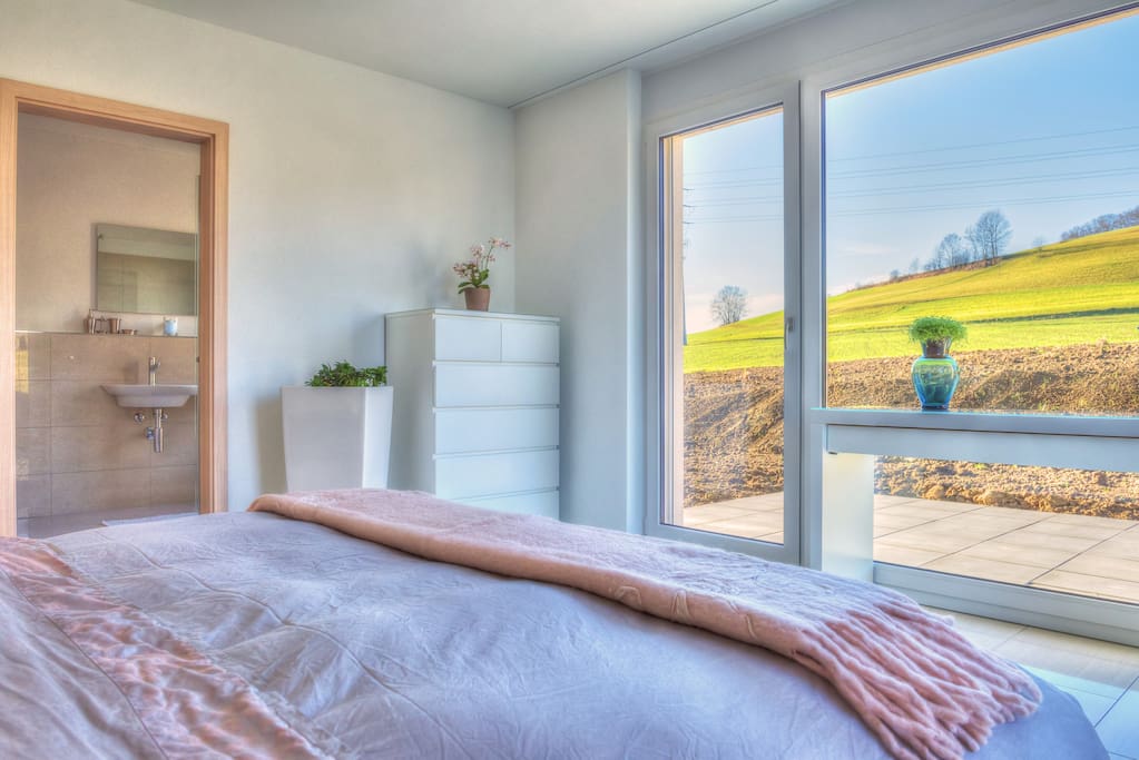 A large private patio / garden offers cozy outdoor living space, also has partial lake views.