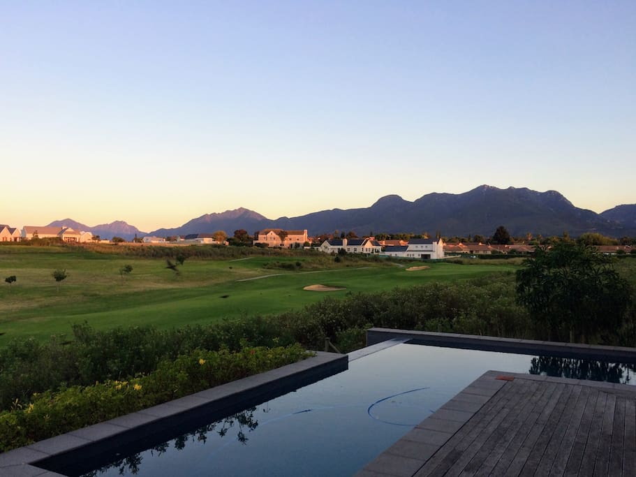 Views of the infinity pool, golf course and mountains