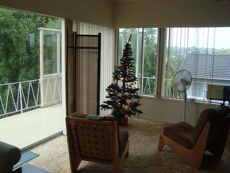 Part of living room with balcony