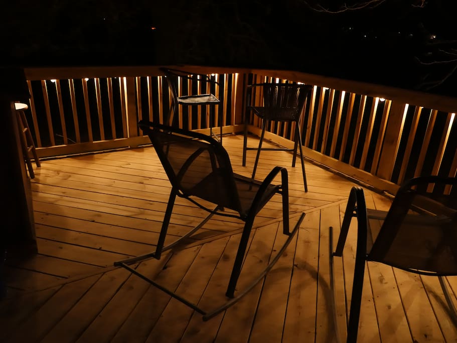 Outdoor deck with bar and firepit access.