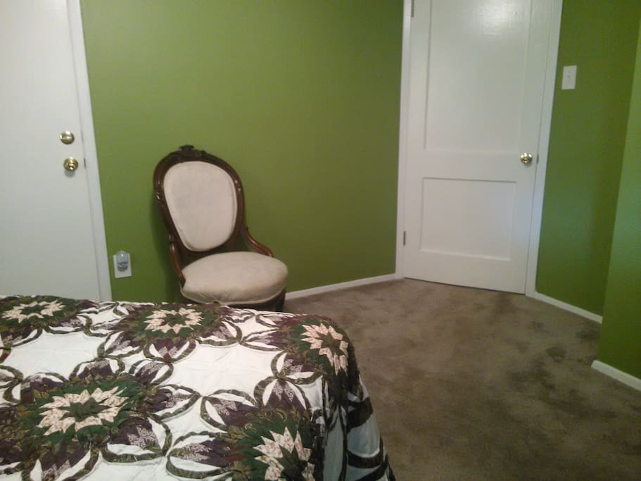 Door on the left leads to the dining area, on the right to the living area