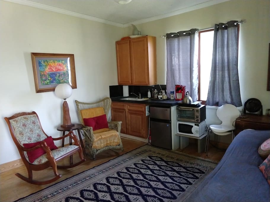 The parlor features a kitchenette, -->