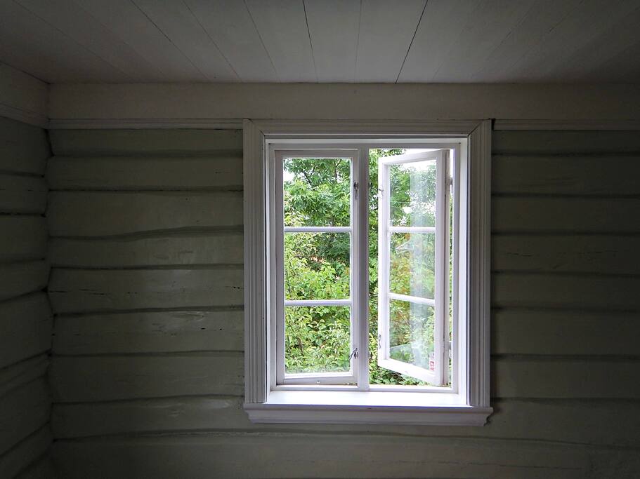 The windows opens up to a charming oasis. The original timberwalls feel warm and comforting