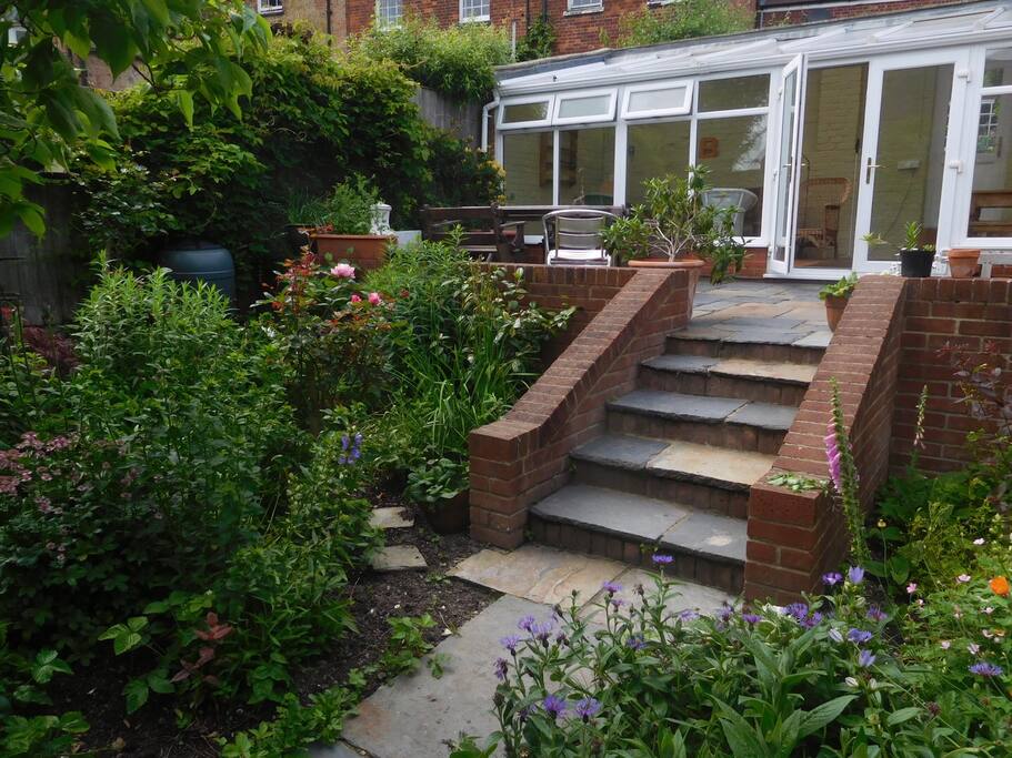 Lower Garden showing the middle conservatory and outside dining area