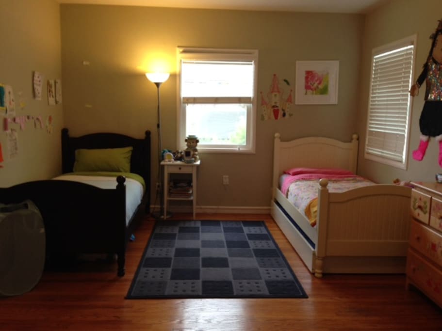 Bedroom with two twin beds and additional trundle bed