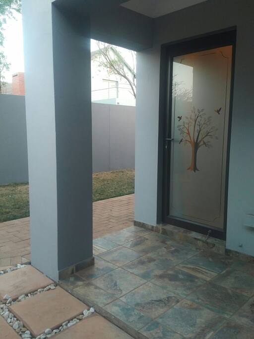 Entrance to the room is outside and under covered patio. The entrance is private.
