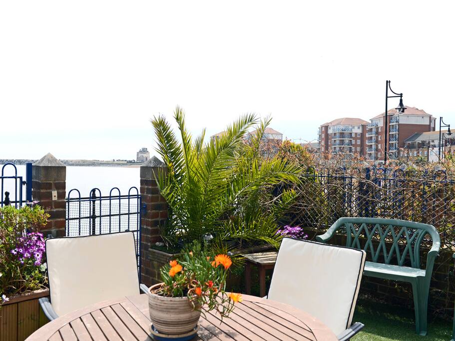 Watch the boats sail past as you enjoy some al fresco dining