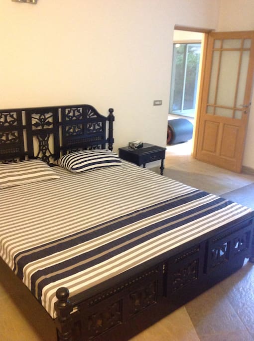 Room with ensuite and pantry having large windows towards the home garden.