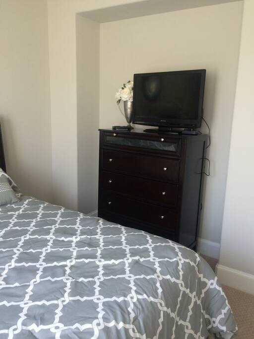 Television in the guest room with cable and Apple TV available.