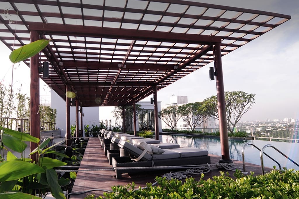 Sun deck chairs overlooking Bangkok metropolis