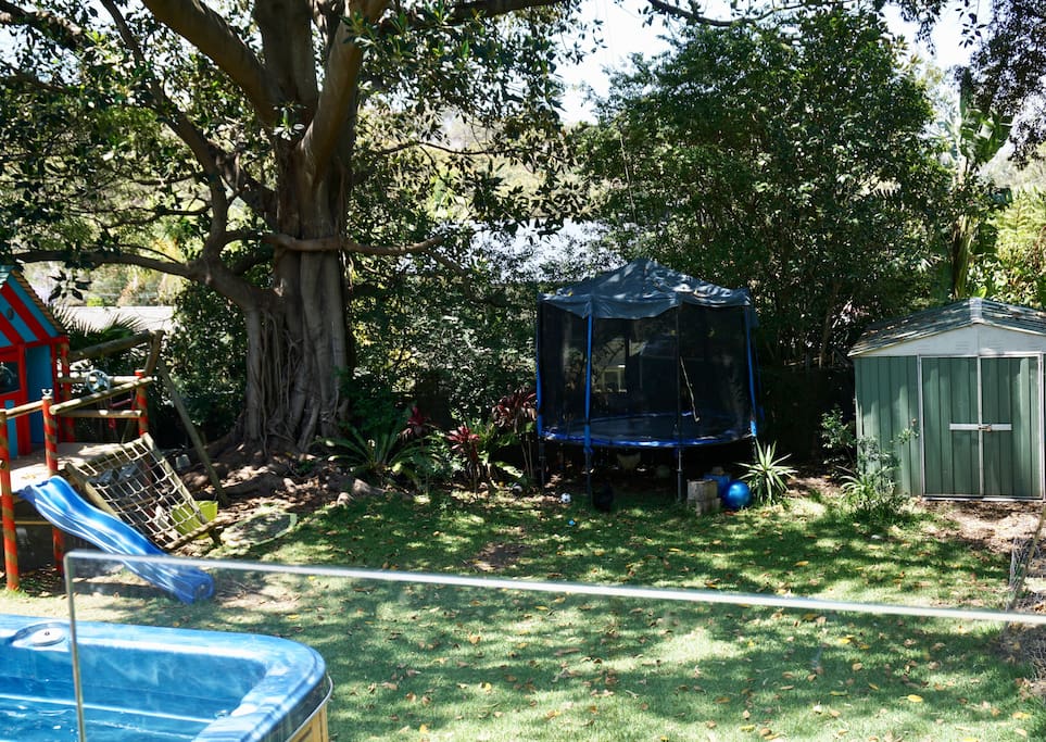Garden with spa, cubby house, swing & trampoline