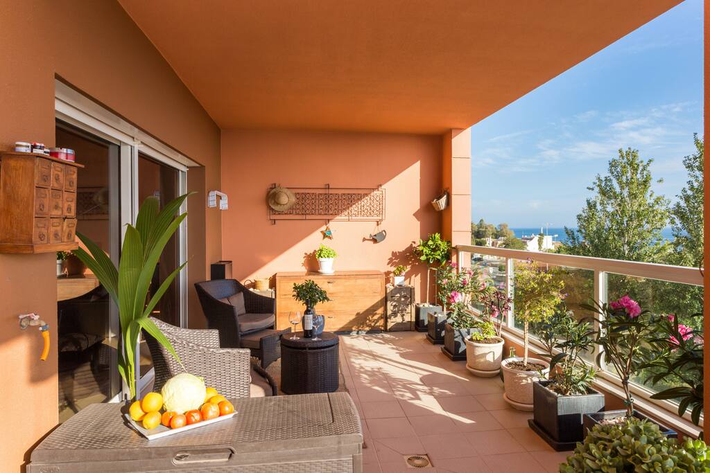 Sunny south facing balcony with sea view and dining area
