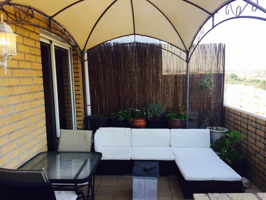 Lounge terrace sofa and exterior eating area, sunrise position.