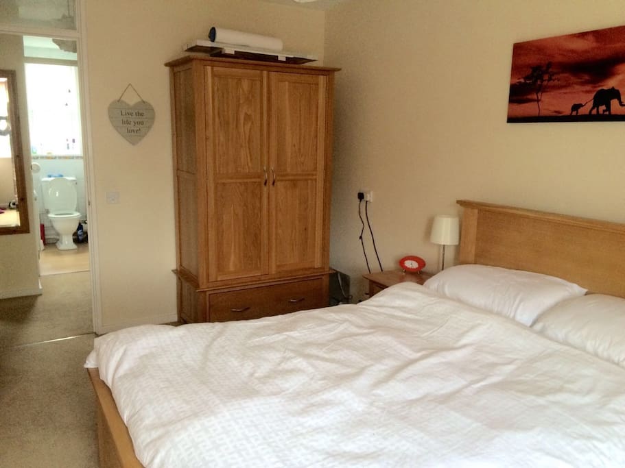 Double bedroom looking through to hall and bathroom