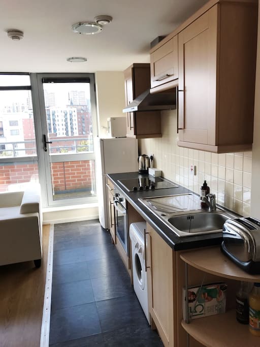 Kitchen and door leading to the balcony