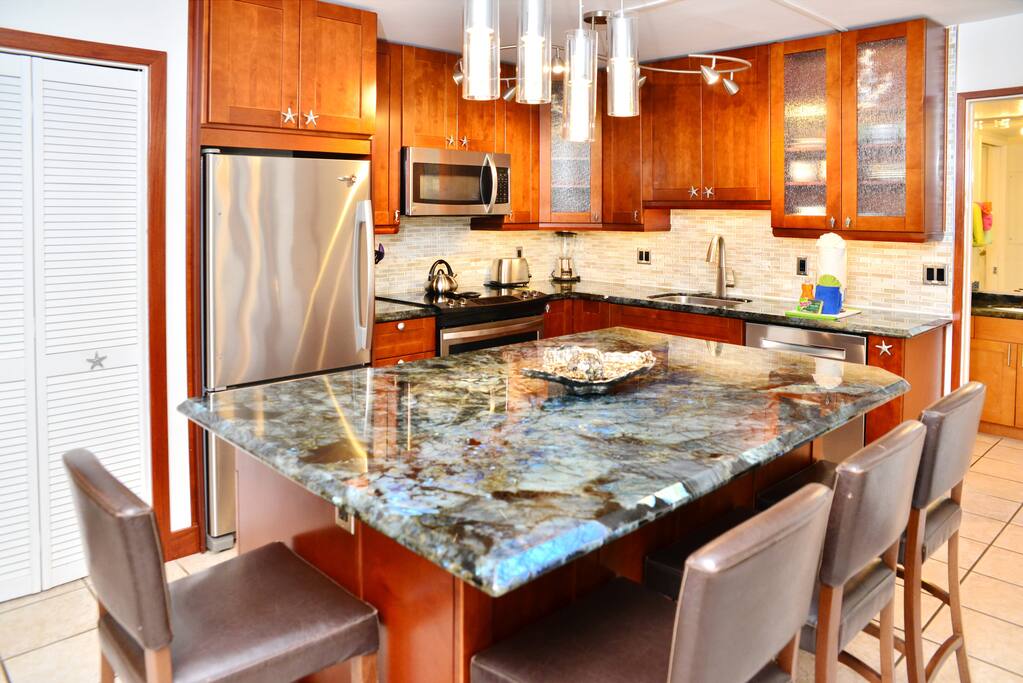 Complete, stunning kitchen remodel. Huge entertaining island with tons of storage and kitchen equipment.
