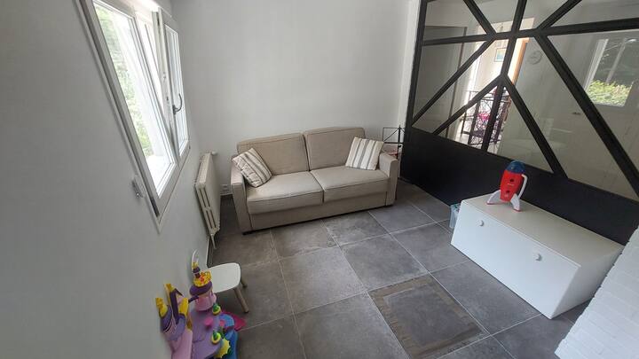 Room adjoining the dining room with sofa bed.