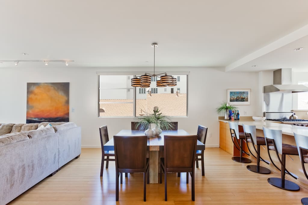 Open Floor Plan features a spacious Dining Room for 6 that flows between the Kitchen and Living Room and Balcony