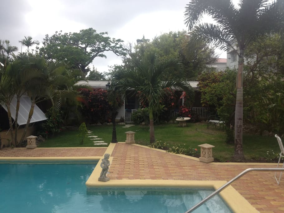 Pool and garden infront of the cottage patio