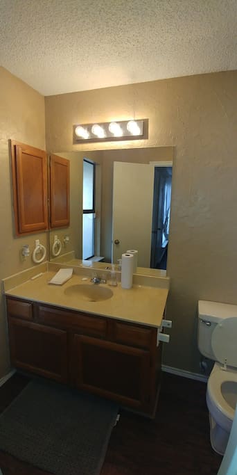 Beautifully decorated, cozy, and spacious en suite bathroom.