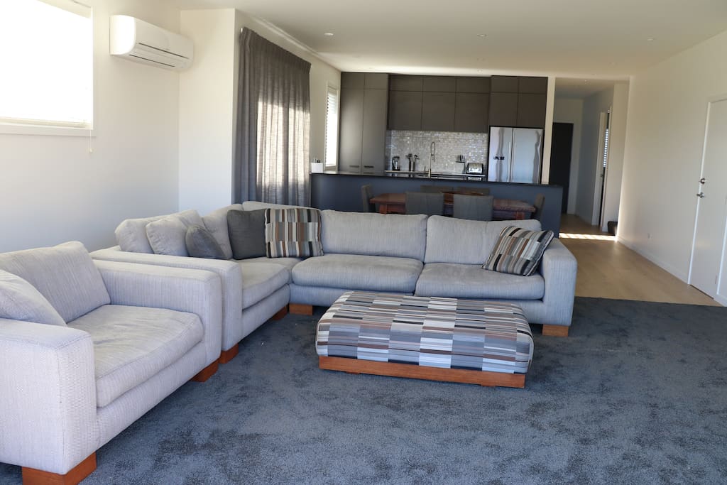 Open Plan lounge with Escea gas fireplace and internet TV